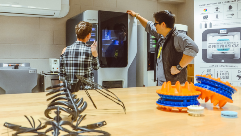 Students wait for 3D printed models to finish in lab space